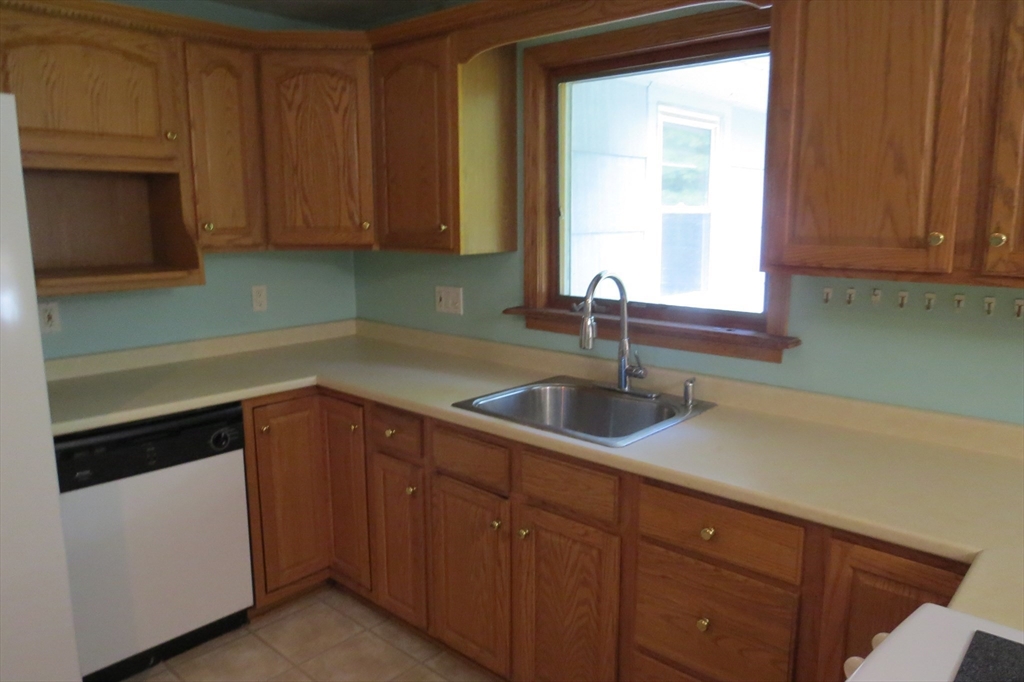 33 Coughlin Road Easton, MA 02356 - Photo 4 of 15 a kitchen with a sink and cabinets