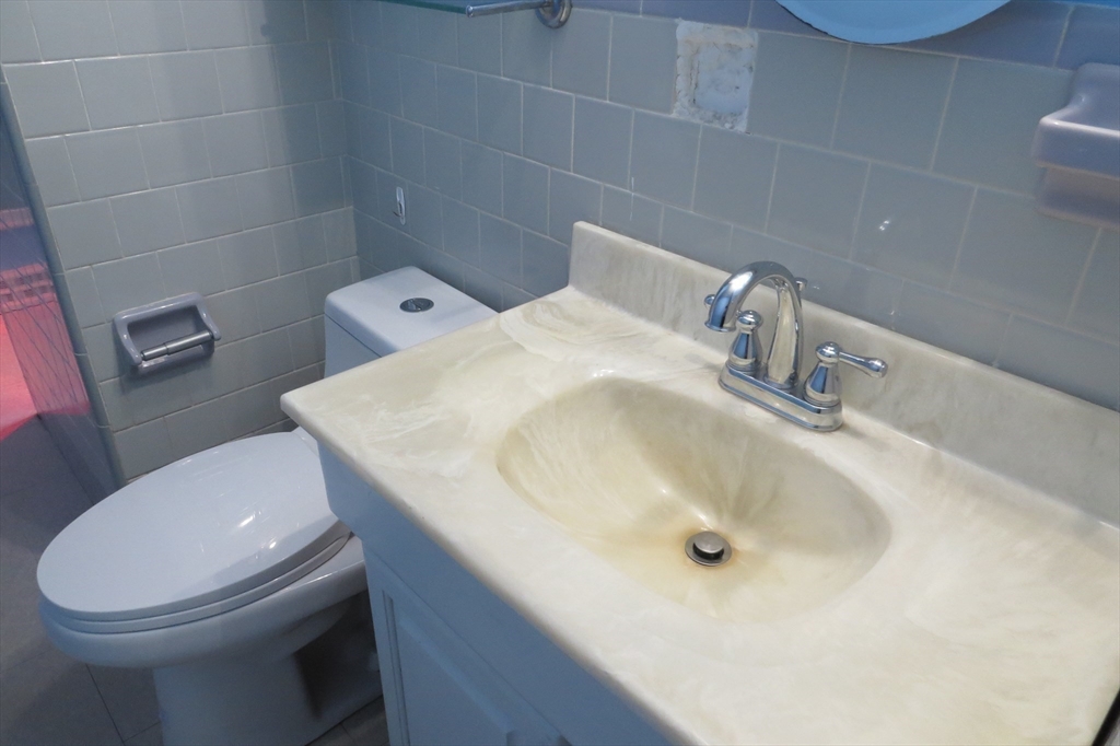 33 Coughlin Road Easton, MA 02356 - Photo 7 of 15 a bathroom with a sink a toilet and a mirror
