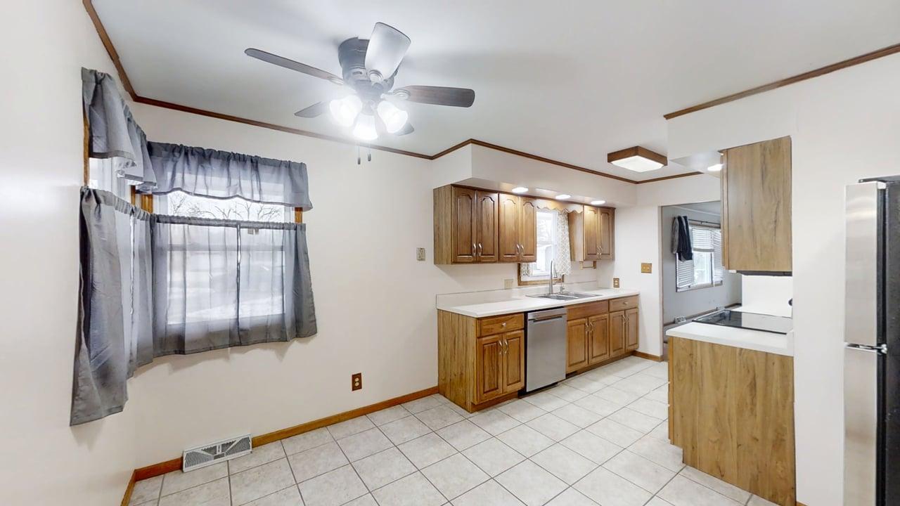605 Douglas Street Catlin, IL 61817 - Photo 12 of 41 a large kitchen with cabinets and stainless steel appliances