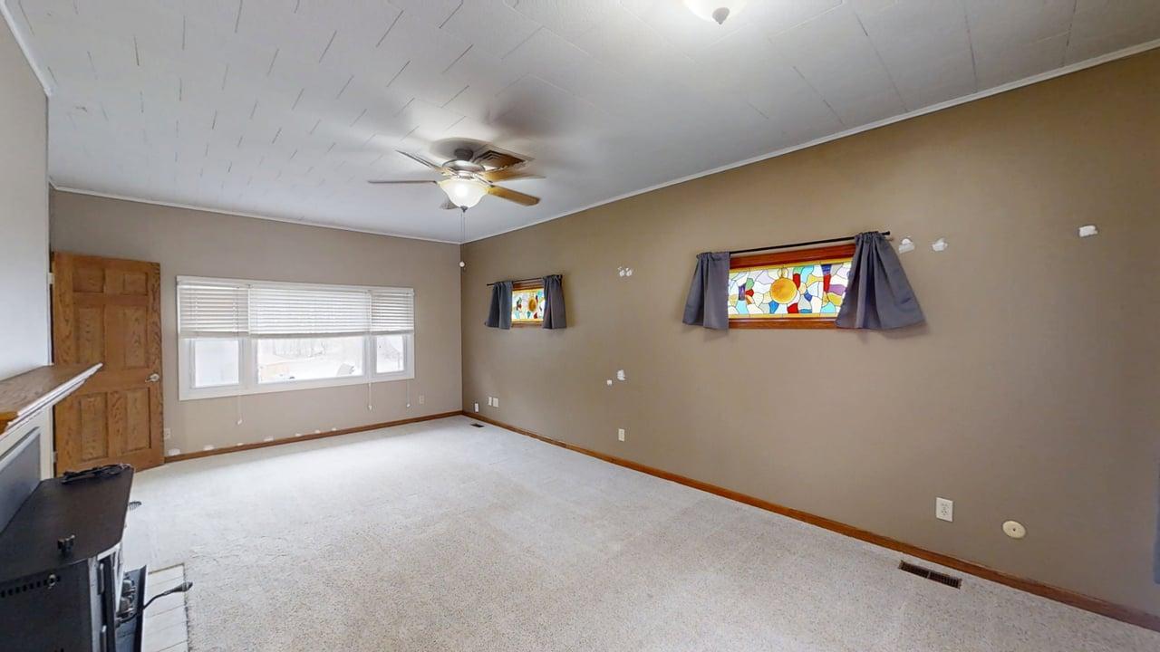 605 Douglas Street Catlin, IL 61817 - Photo 13 of 41 wooden floor in an empty room with a window