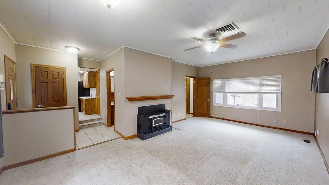 605 Douglas Street Catlin, IL 61817 - Photo 14 of 41 a view of a livingroom with a fireplace and window