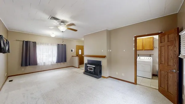 a view of an empty room with a window