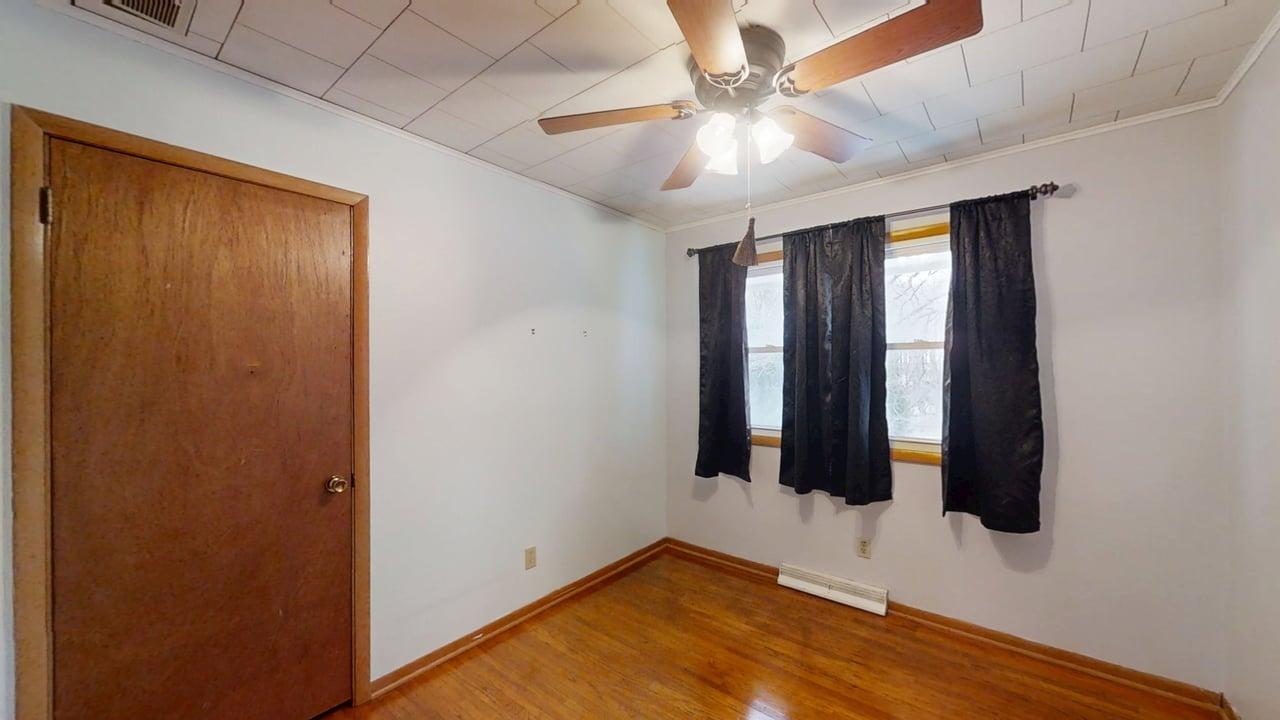 605 Douglas Street Catlin, IL 61817 - Photo 23 of 41 wooden floor in an empty room with a window