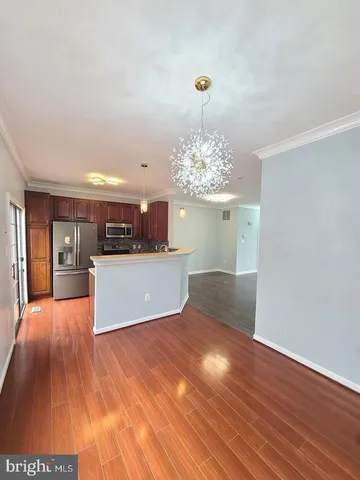 a view of a kitchen with microwave and cabinets