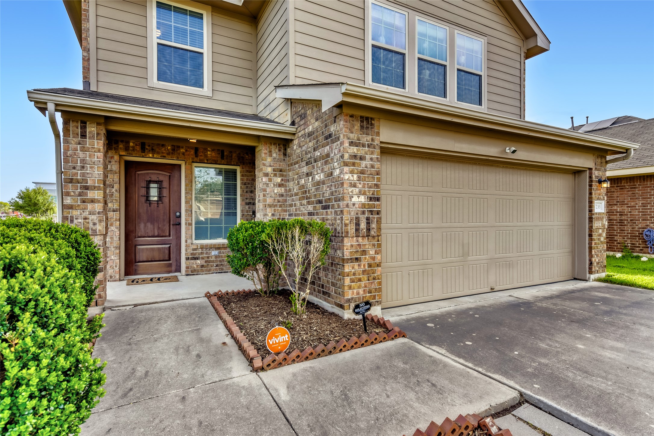 7233 Crestone Road Austin, TX 78744 - Photo 1 of 1 Front of the home. Nice planter beds and a covered front porch