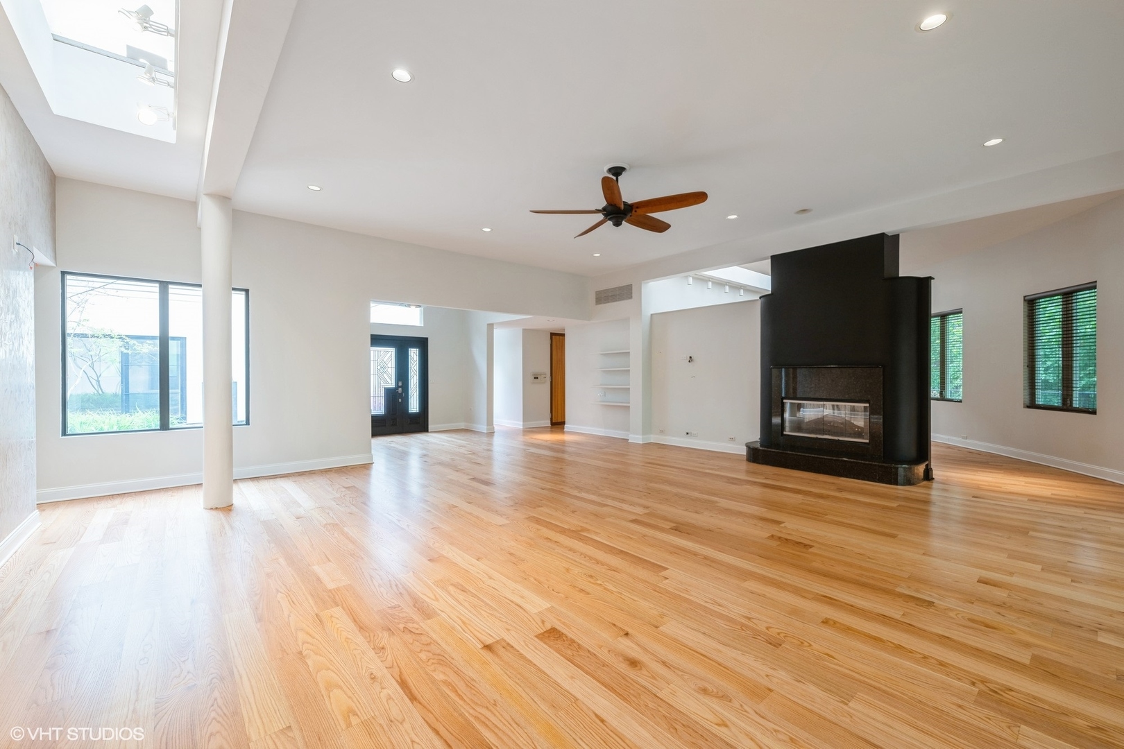 2000 Clendenin Lane Riverwoods, IL 60015 - Photo 5 of 51 a view of a livingroom with wooden floor and a ceiling fan