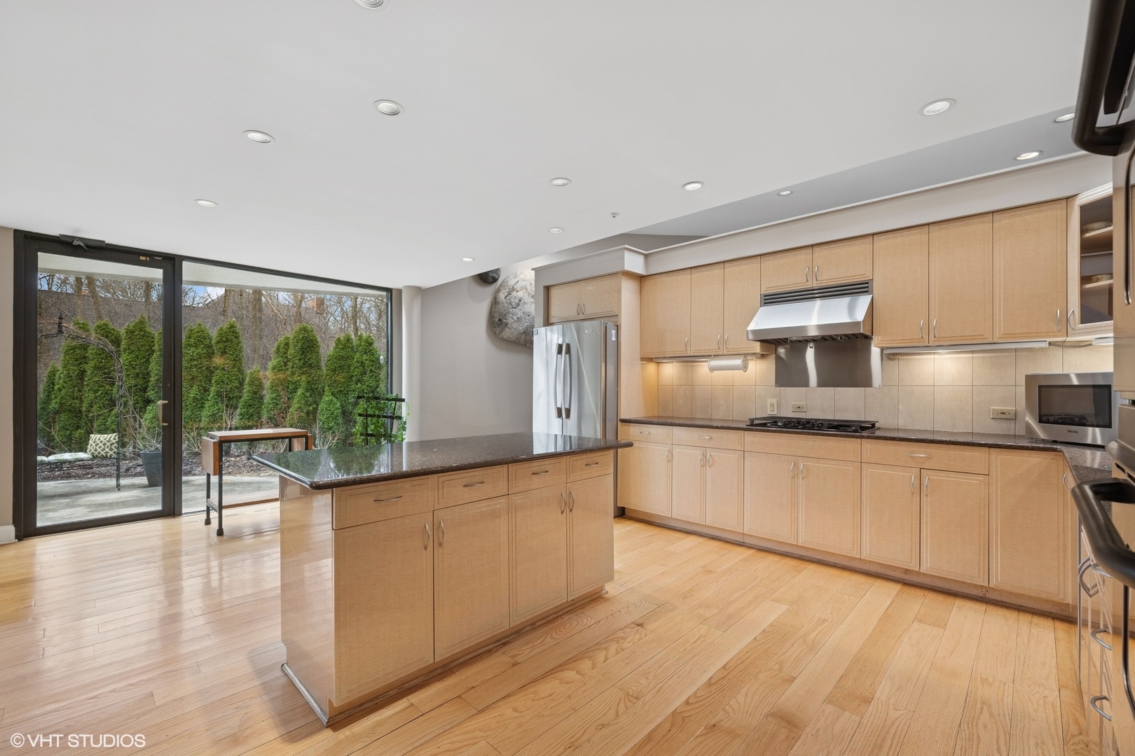2000 Clendenin Lane Riverwoods, IL 60015 - Photo 10 of 51 a large kitchen with granite countertop a large window and stainless steel appliances