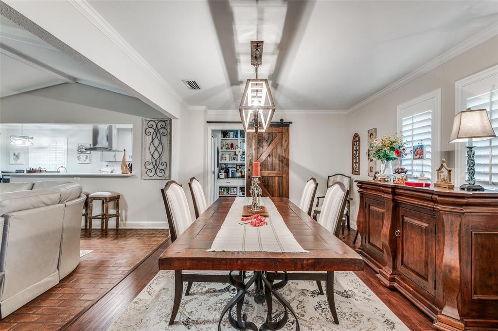 3946 Candlenut Lane Dallas, TX 75244 - Photo 11 of 25 a view of a dining room with furniture window and wooden floor