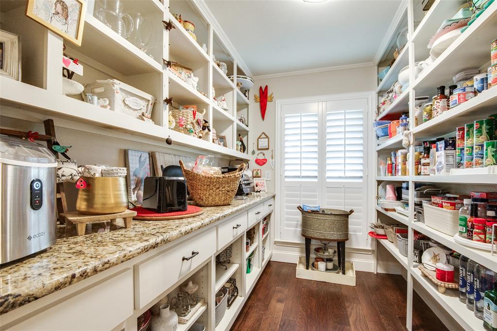 3946 Candlenut Lane Dallas, TX 75244 - Photo 12 of 25 a kitchen with lots of counter top space and wooden floor
