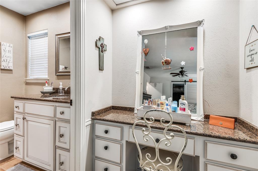 3946 Candlenut Lane Dallas, TX 75244 - Photo 15 of 25 a kitchen with a sink stove and cabinets