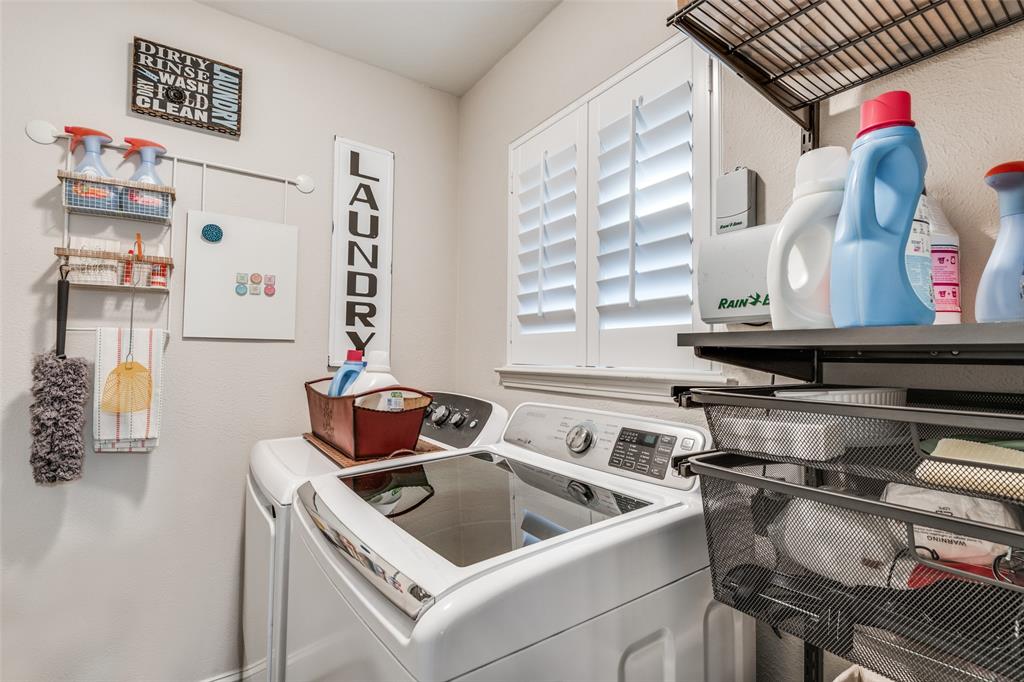 3946 Candlenut Lane Dallas, TX 75244 - Photo 20 of 25 a kitchen with a stove and a sink