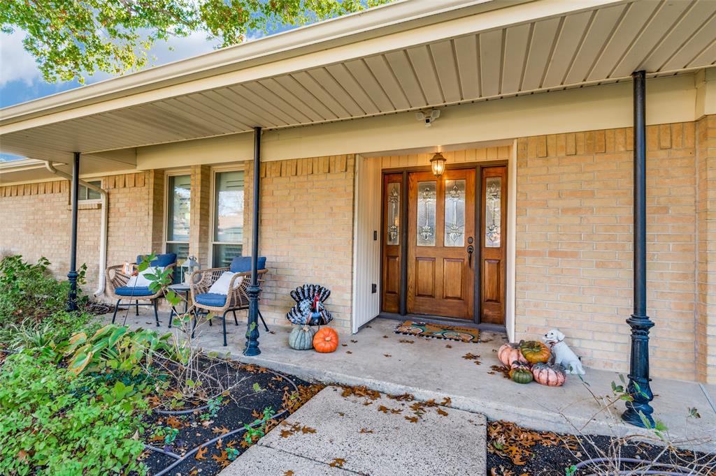 3946 Candlenut Lane Dallas, TX 75244 - Photo 3 of 25 a front view of a house with outdoor seating