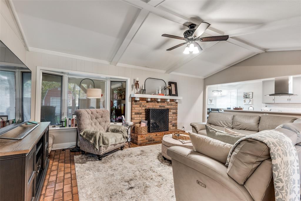 3946 Candlenut Lane Dallas, TX 75244 - Photo 5 of 25 a living room with furniture and a fireplace