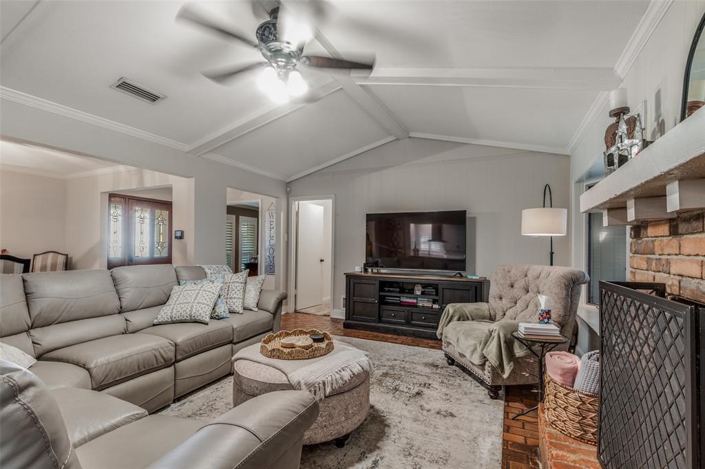 3946 Candlenut Lane Dallas, TX 75244 - Photo 6 of 25 a living room with furniture and a flat screen tv