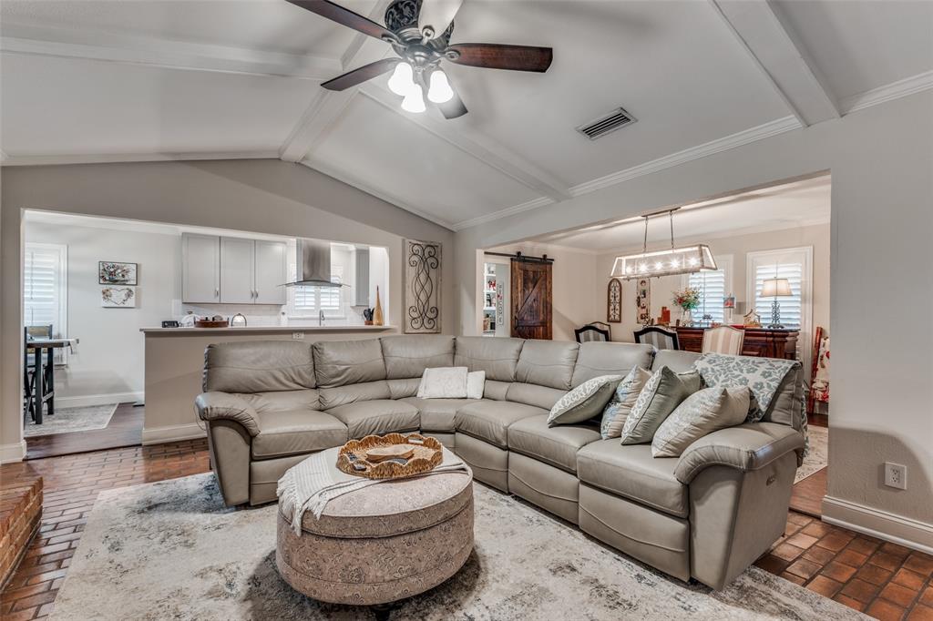 3946 Candlenut Lane Dallas, TX 75244 - Photo 7 of 25 a living room with furniture and a view of kitchen