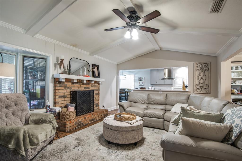 3946 Candlenut Lane Dallas, TX 75244 - Photo 8 of 25 a living room with furniture and a fireplace