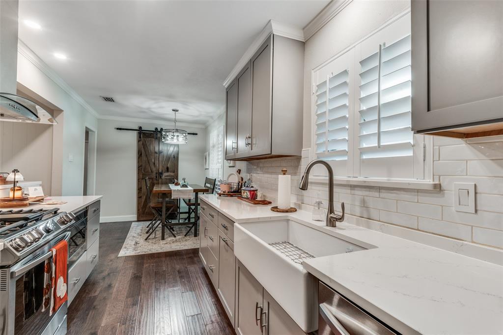 3946 Candlenut Lane Dallas, TX 75244 - Photo 9 of 25 a kitchen with a sink cabinets and wooden floor