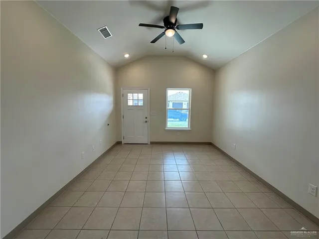 a view of an empty room with a window