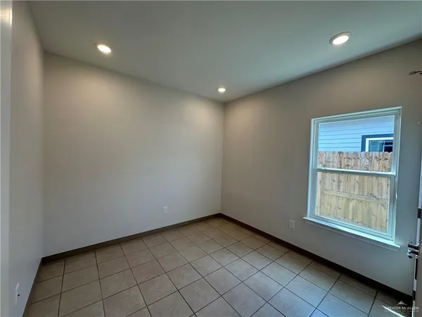 a view of an empty room and window