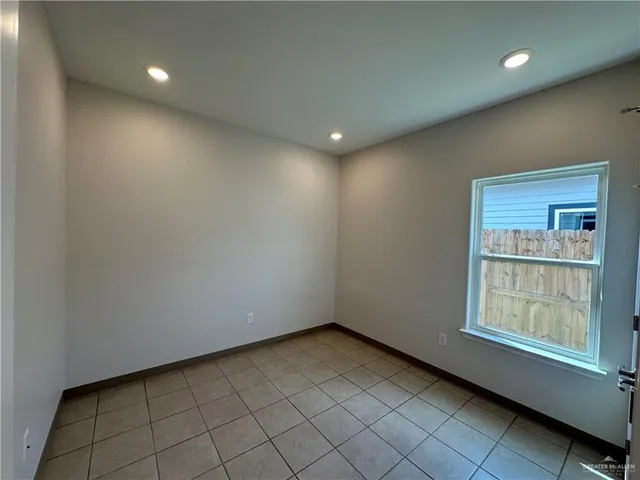 a view of an empty room and window