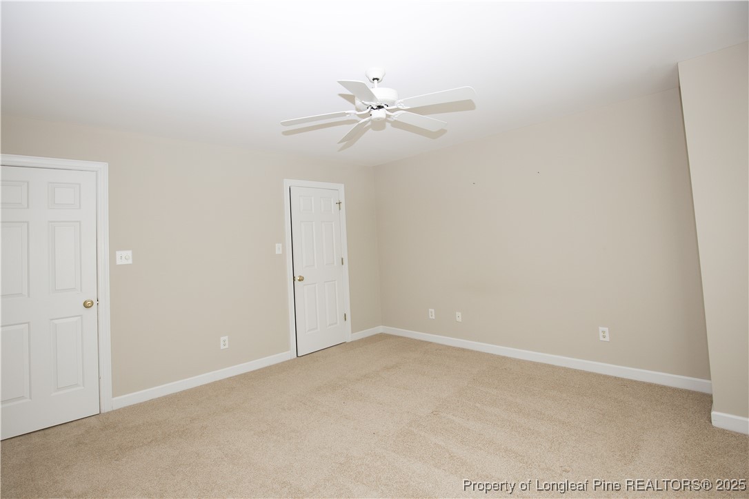 175 Knoll Road Southern Pines, NC 28387 - Photo 39 of 50 an empty room with closet and a ceiling fan