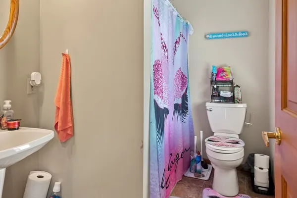 a bathroom with a sink toilet and a shower