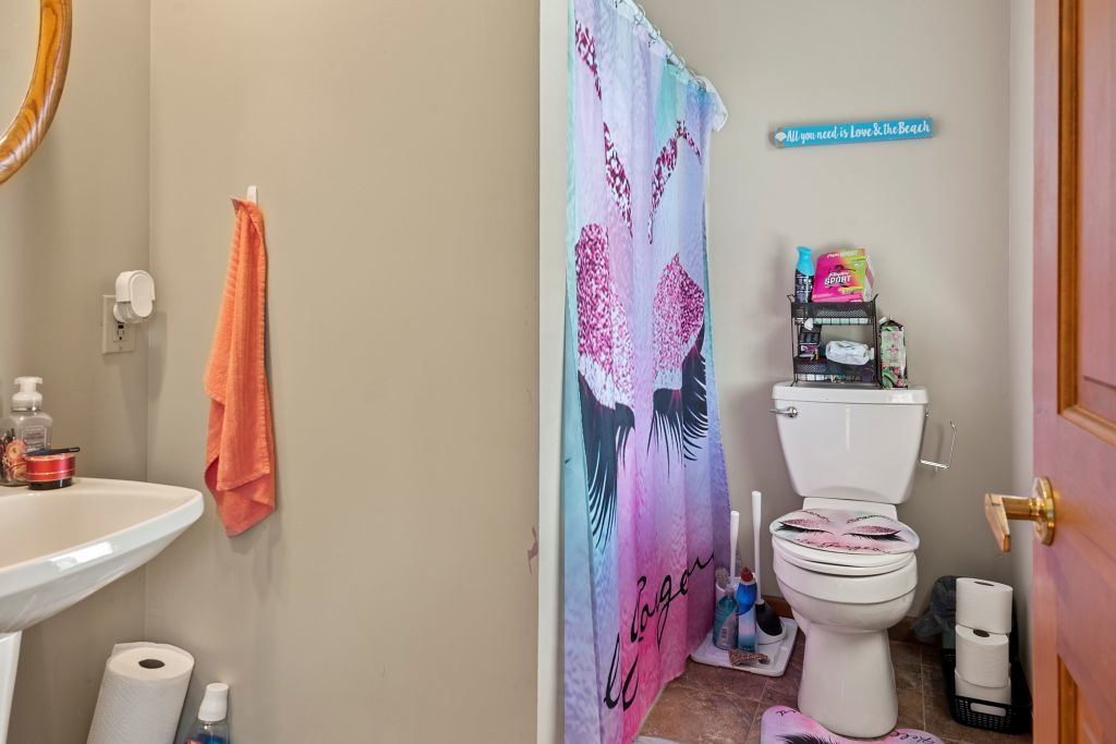 3609 West Iles Avenue Springfield, IL 62711 - Photo 16 of 30 a bathroom with a sink toilet and a shower