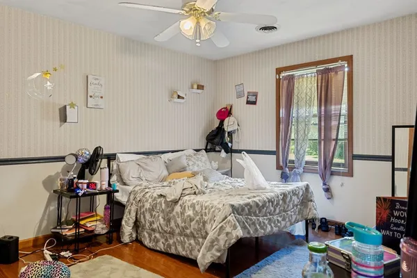 a bed room with a bed and a window