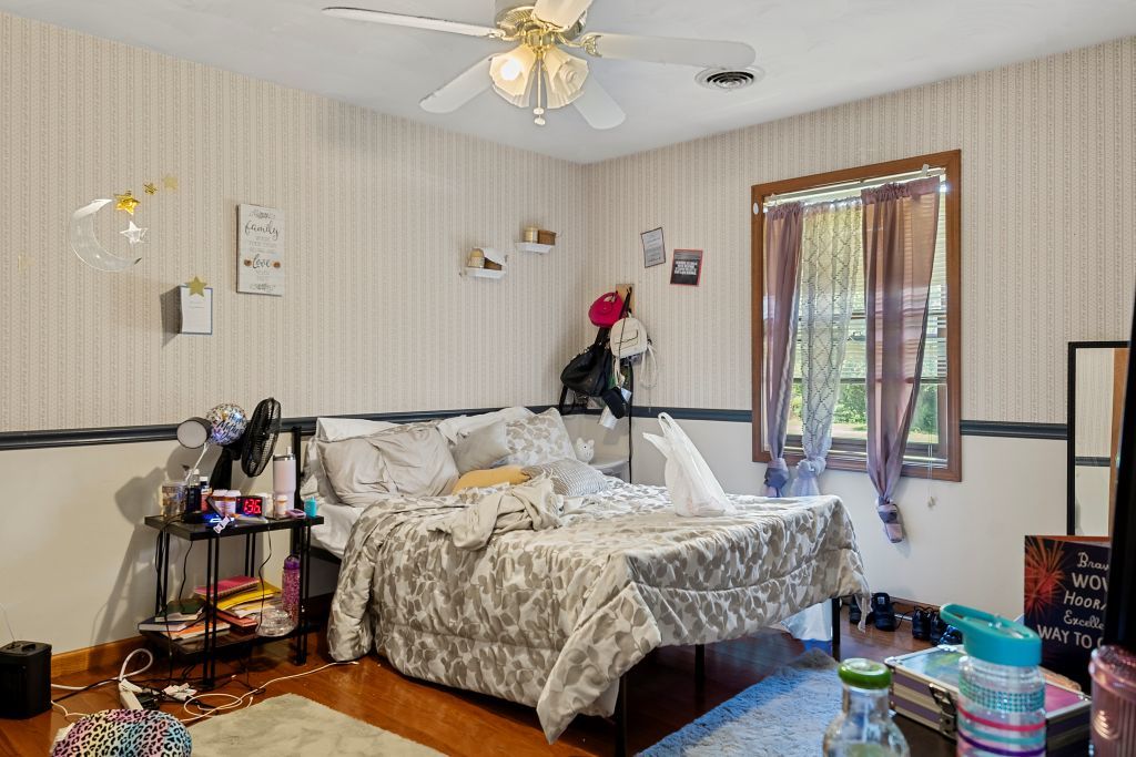 3609 West Iles Avenue Springfield, IL 62711 - Photo 17 of 30 a bed room with a bed and a window