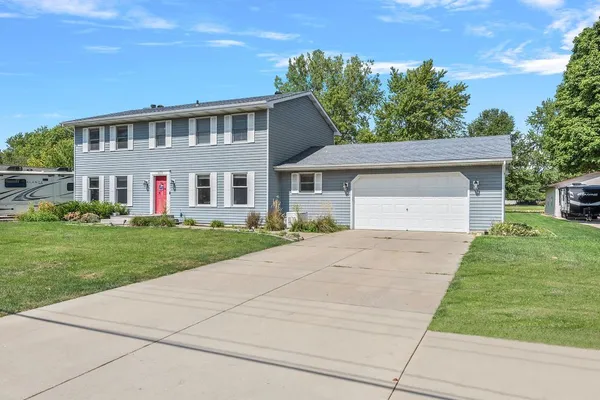 front view of a house with a yard