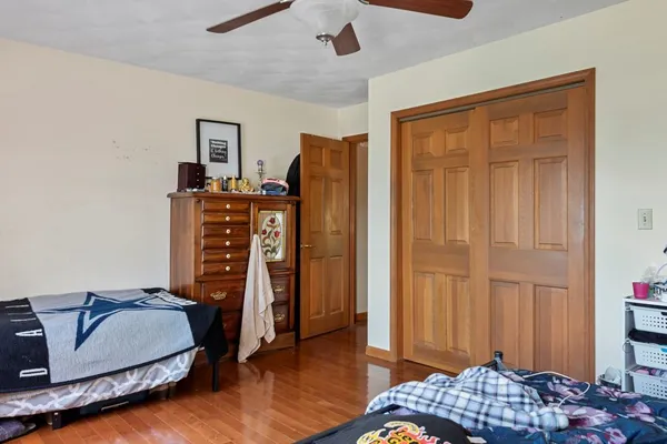 a bedroom with furniture and a window