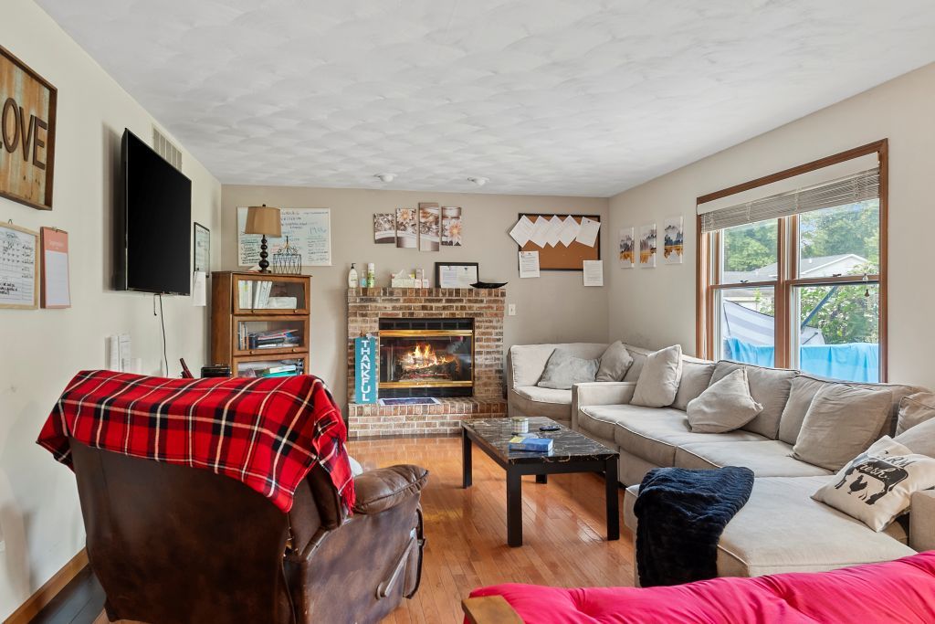 3609 West Iles Avenue Springfield, IL 62711 - Photo 5 of 30 a living room with furniture and a flat screen tv