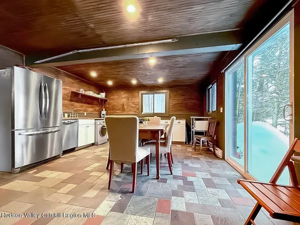 a view of a dining room with furniture window and outside view