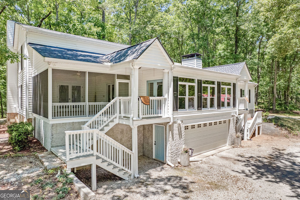 230 Haynes Road Moreland, GA 30259 - Photo 29 of 38 a view of a house with a porch and wooden fence