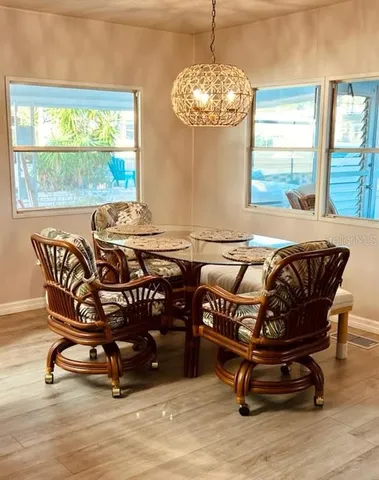 a living room with furniture flowerpot and window