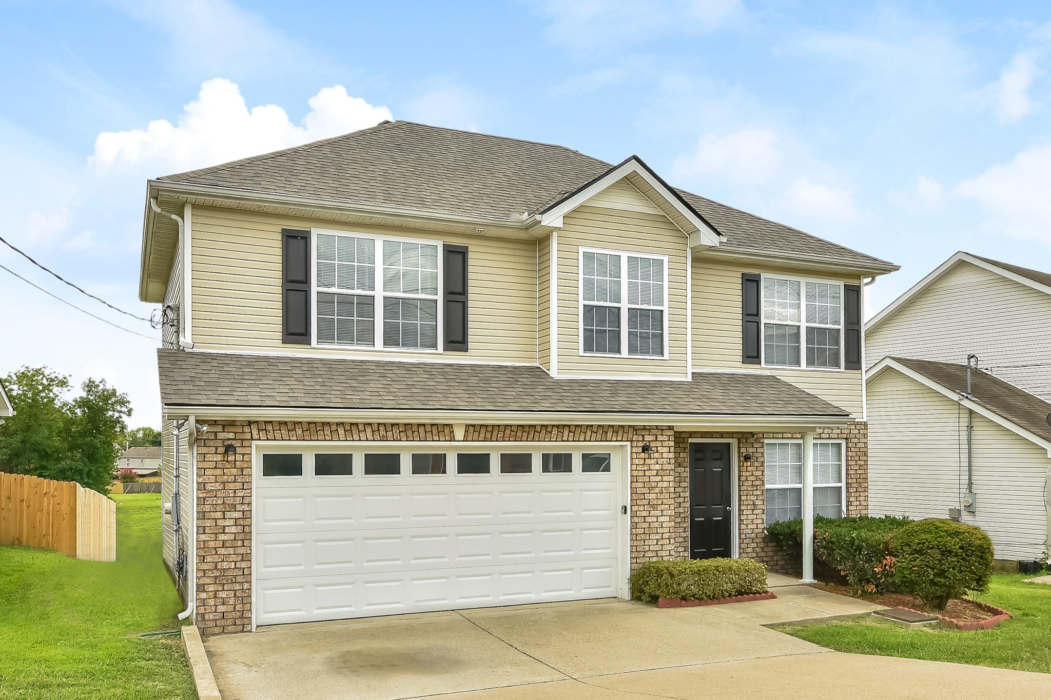1224 Maritime Port Antioch, TN 37013 - Photo 2 of 17 a front view of a house with garden