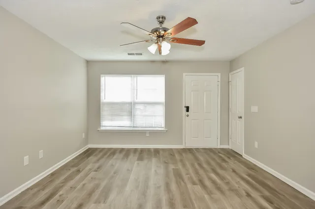 a view of an empty room with a window