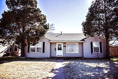 a view of a house with a tree