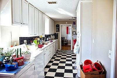 3319 26th Street Lubbock, TX 79410 - Photo 4 of 8 a kitchen with stainless steel appliances kitchen island granite countertop a sink and a microwave