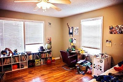 3319 26th Street Lubbock, TX 79410 - Photo 6 of 8 a bed room with furniture and a window