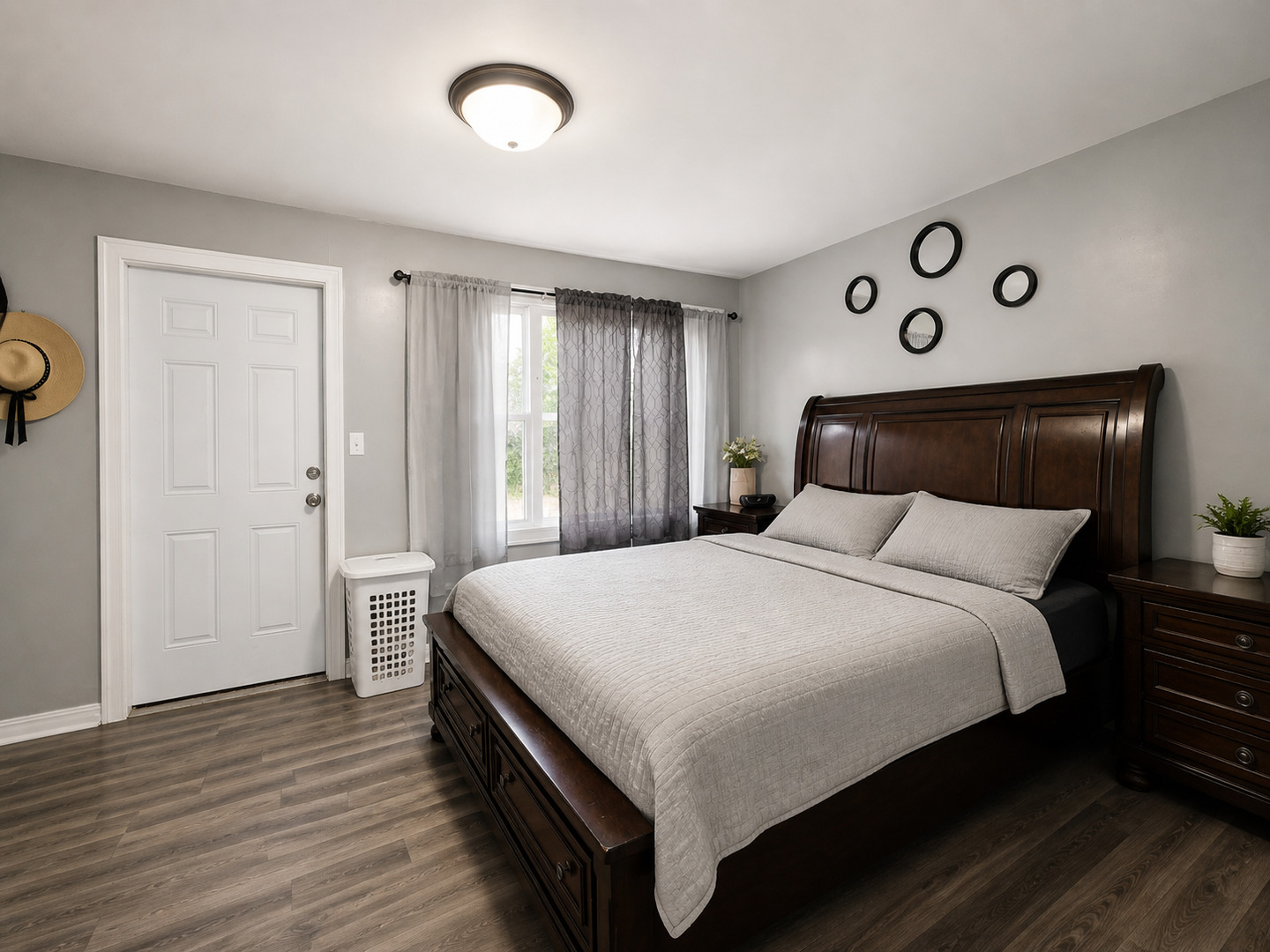 720 Adams Street Elgin, IL 60123 - Photo 13 of 16 a bedroom with a bed and wooden floor