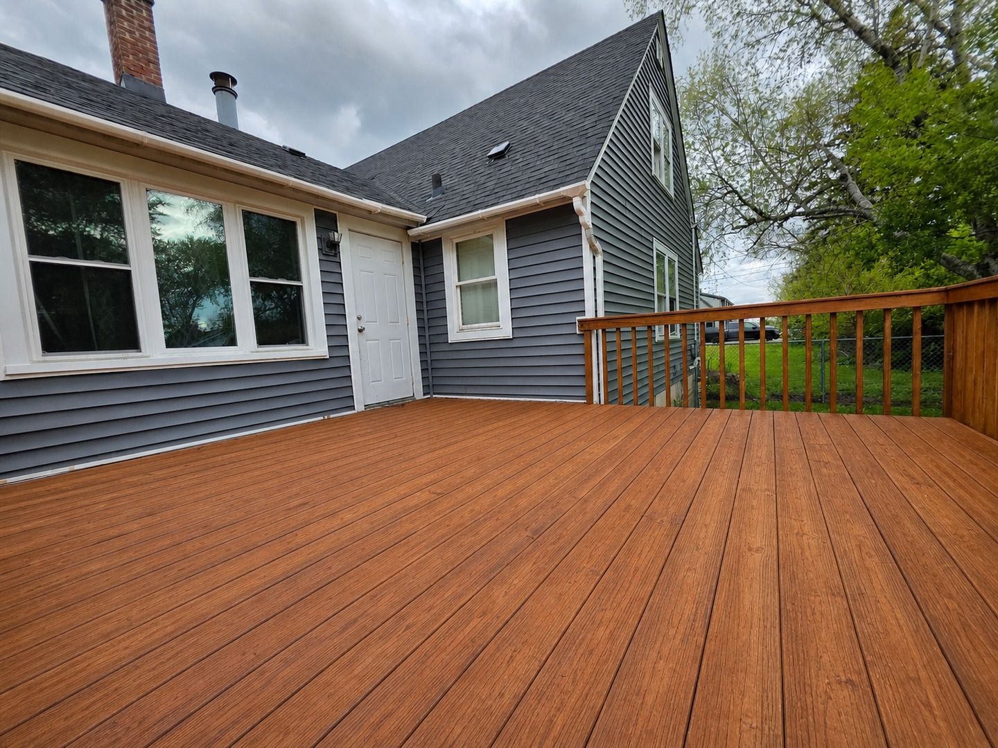 720 Adams Street Elgin, IL 60123 - Photo 14 of 16 a view of a house with wooden deck