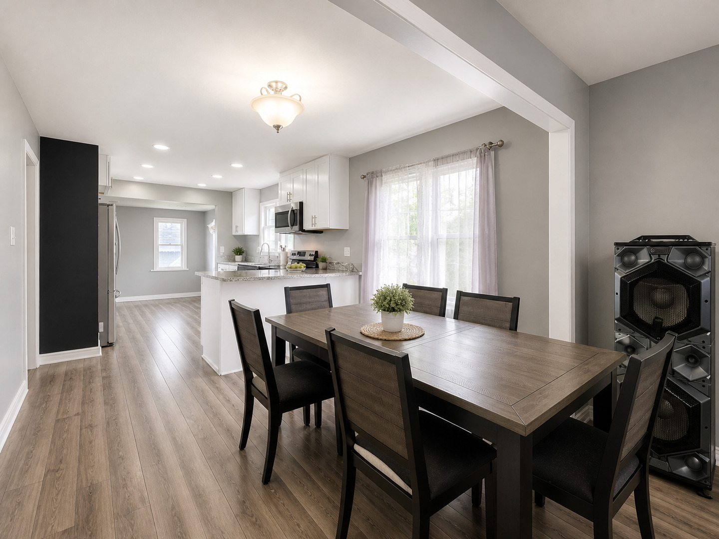 720 Adams Street Elgin, IL 60123 - Photo 4 of 16 a view of a dining room with furniture and wooden floor