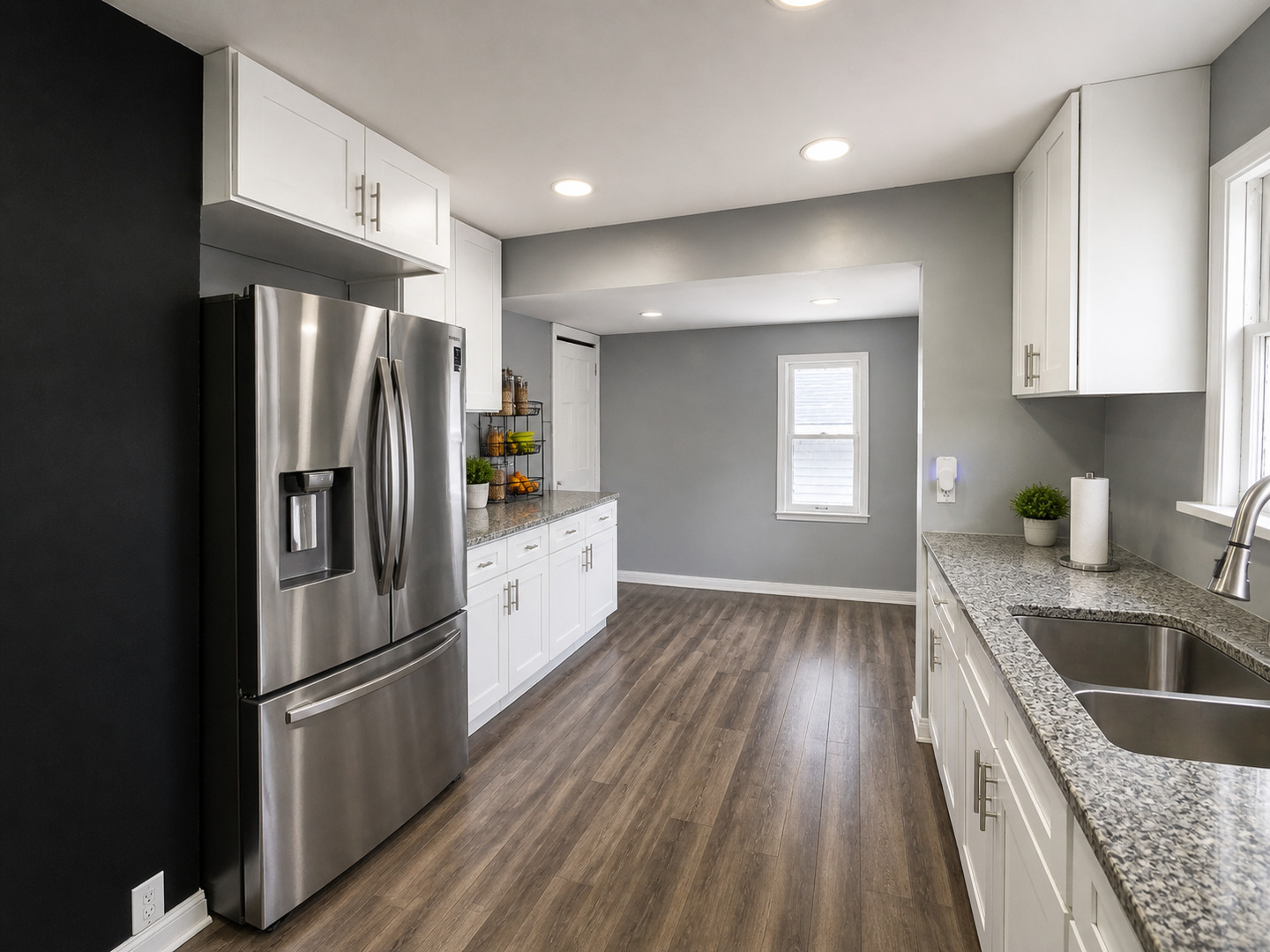 720 Adams Street Elgin, IL 60123 - Photo 6 of 16 a kitchen with a refrigerator sink and cabinets