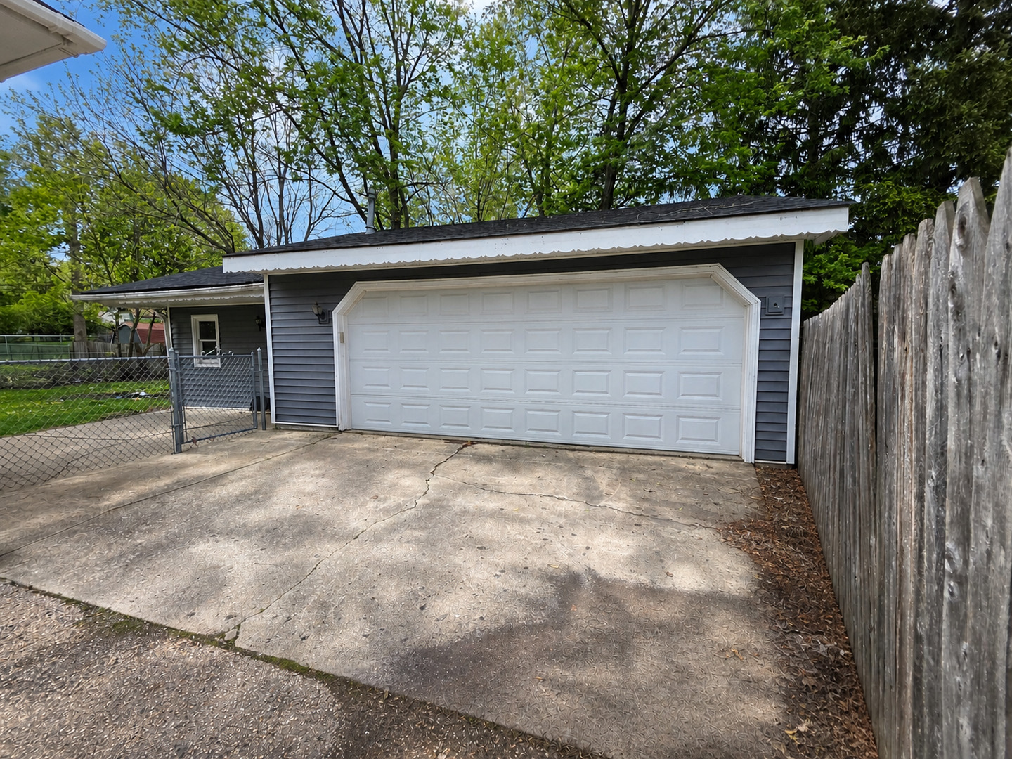720 Adams Street Elgin, IL 60123 - Photo 9 of 16 a backyard of a house with garage