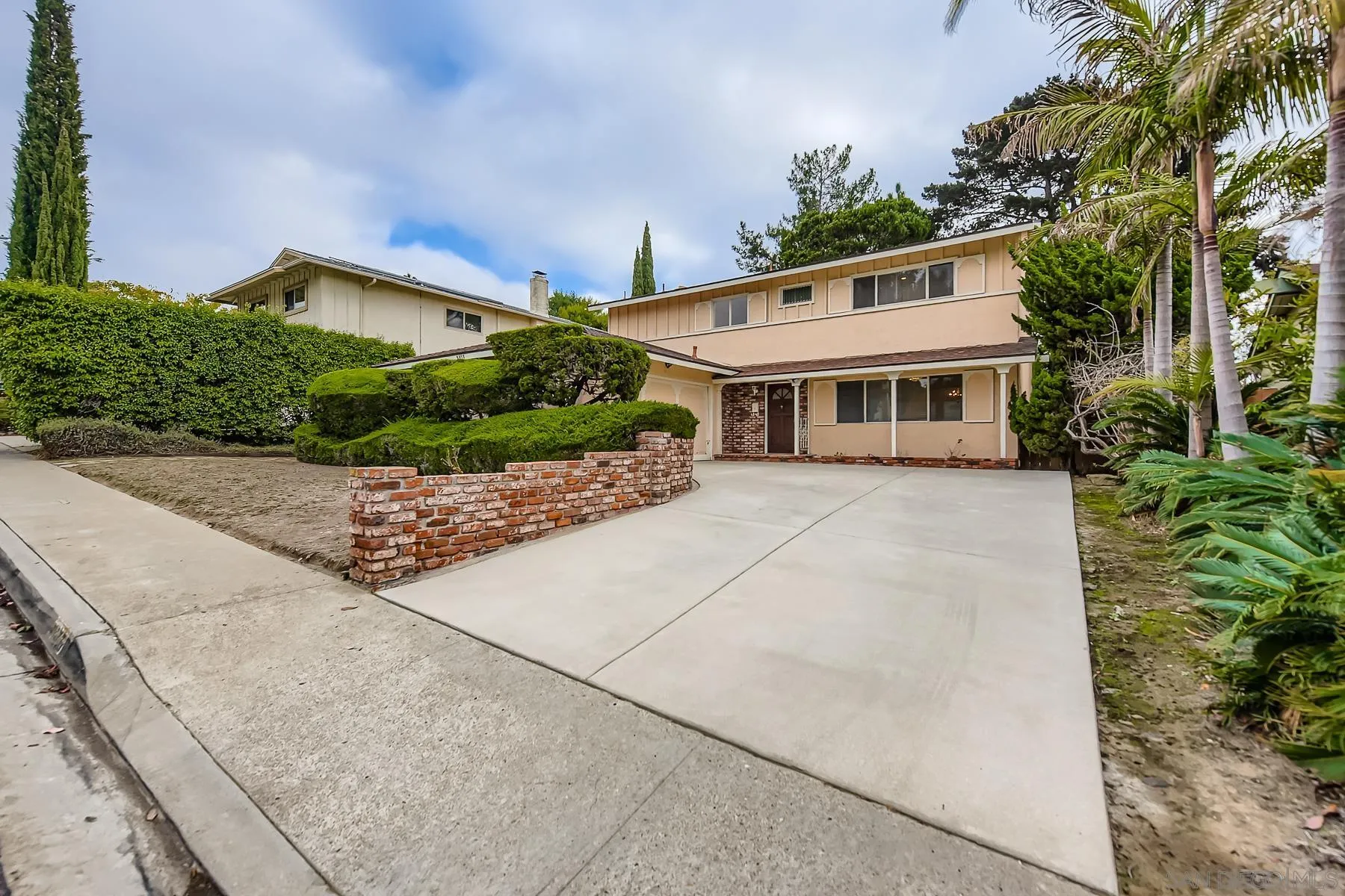 a house view with a garden space
