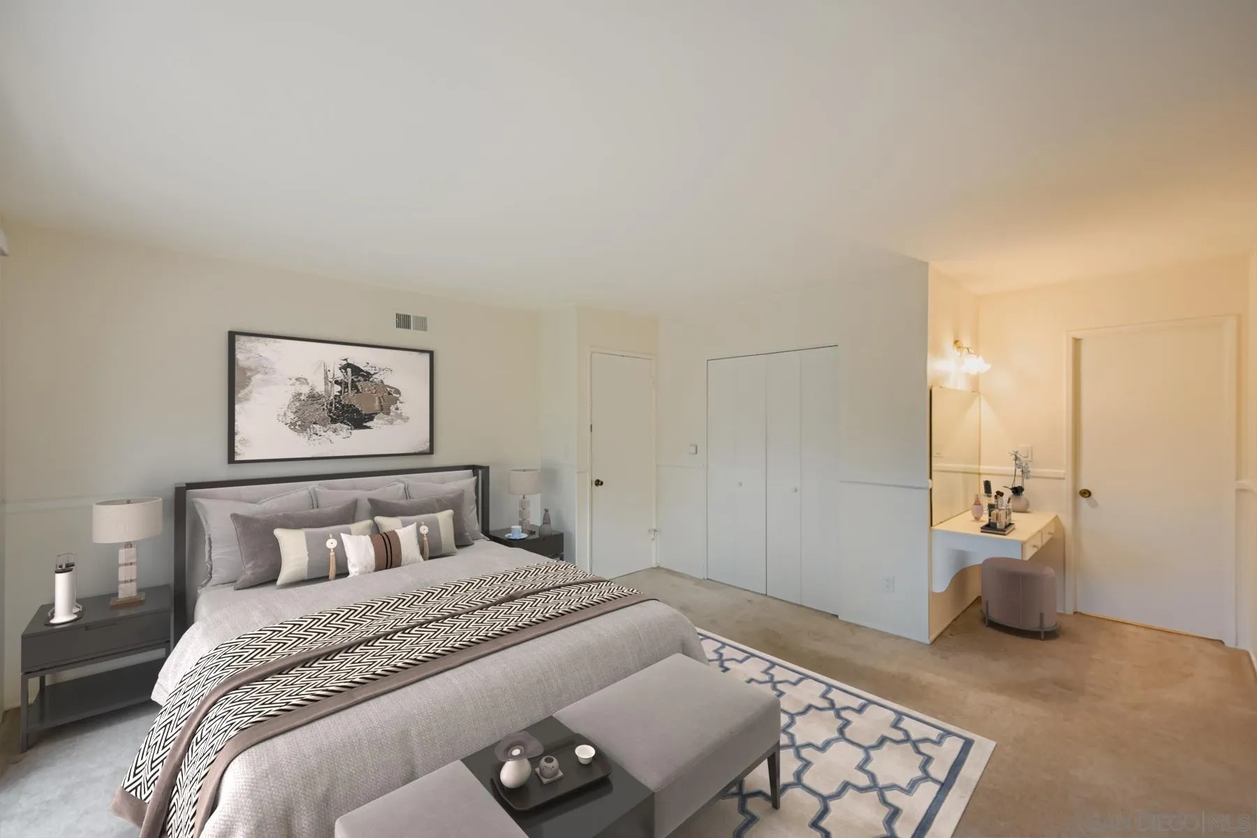 5977 Agee Street San Diego, CA 92122 - Photo 17 of 25 a bedroom with a bed and a couch