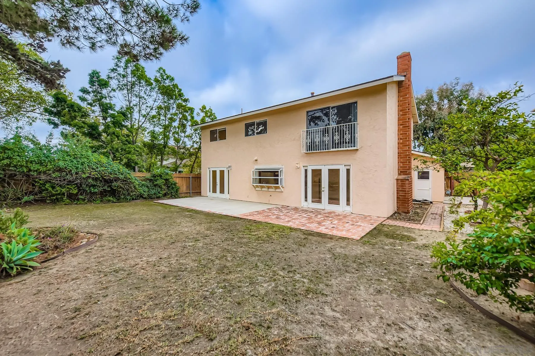 5977 Agee Street San Diego, CA 92122 - Photo 24 of 25 front view of a house with a yard