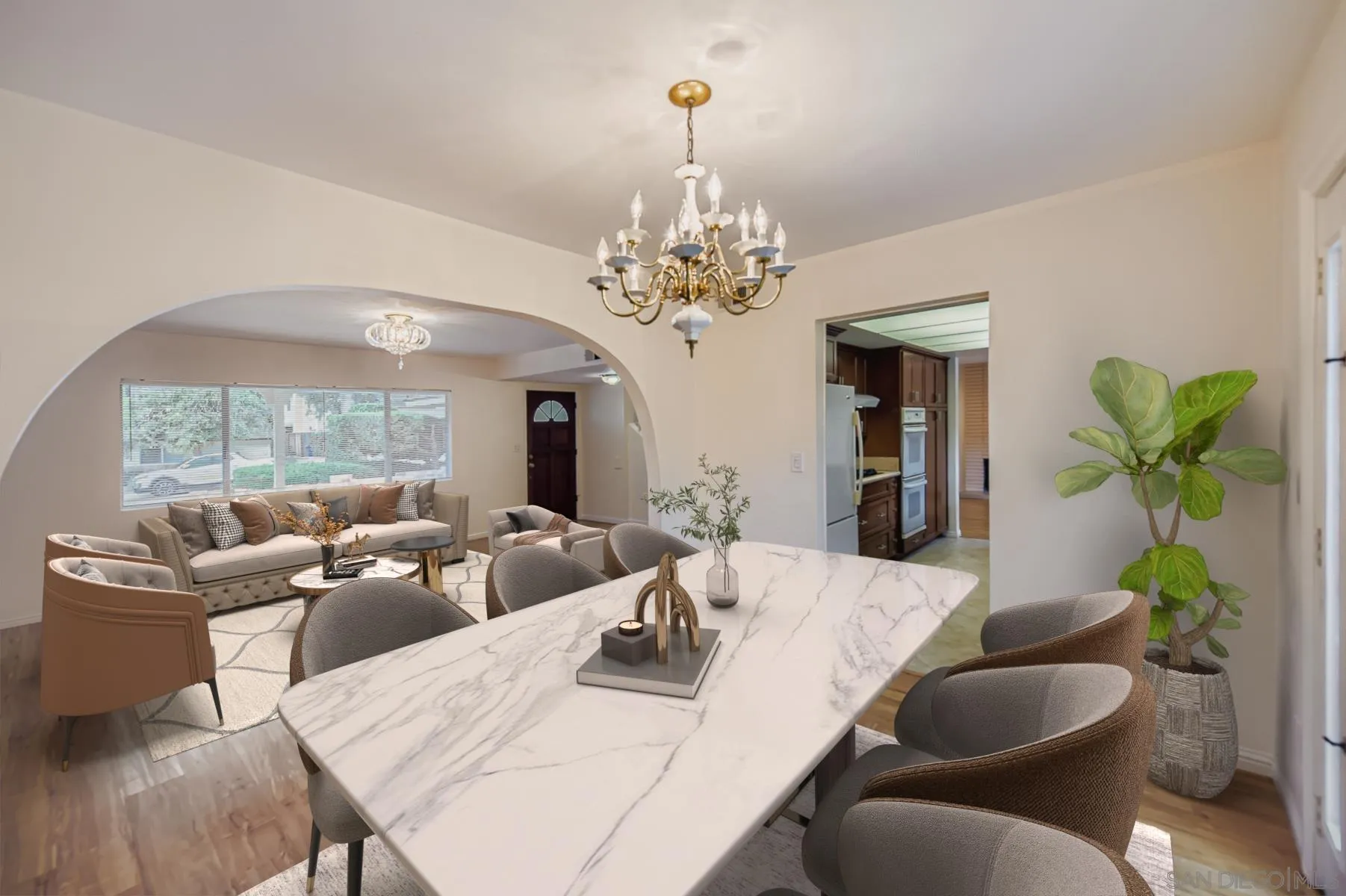 5977 Agee Street San Diego, CA 92122 - Photo 6 of 25 a living room with fireplace furniture and a chandelier