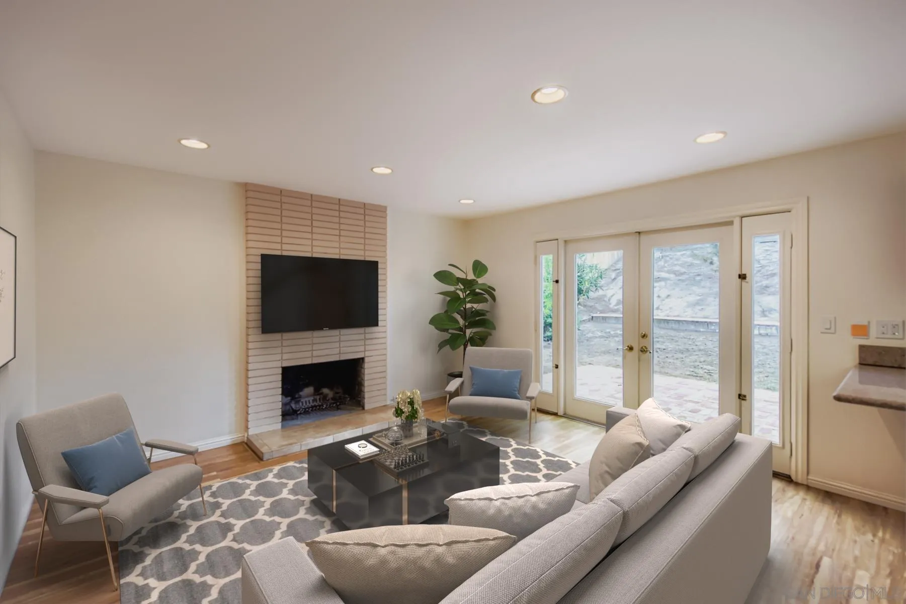 5977 Agee Street San Diego, CA 92122 - Photo 9 of 25 a living room with furniture and a fireplace